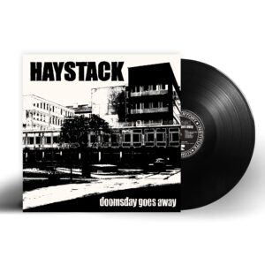 Haystack's 'Doomsday Goes Away' album vinyl LP with black record partially pulled out, showcasing the label. “Haystack! Ny Skiva Ute. Skruvad Oljudsrock.” / “Haystack! New Album Out. Twisted Noise Rock.” – Ulf Cederlund